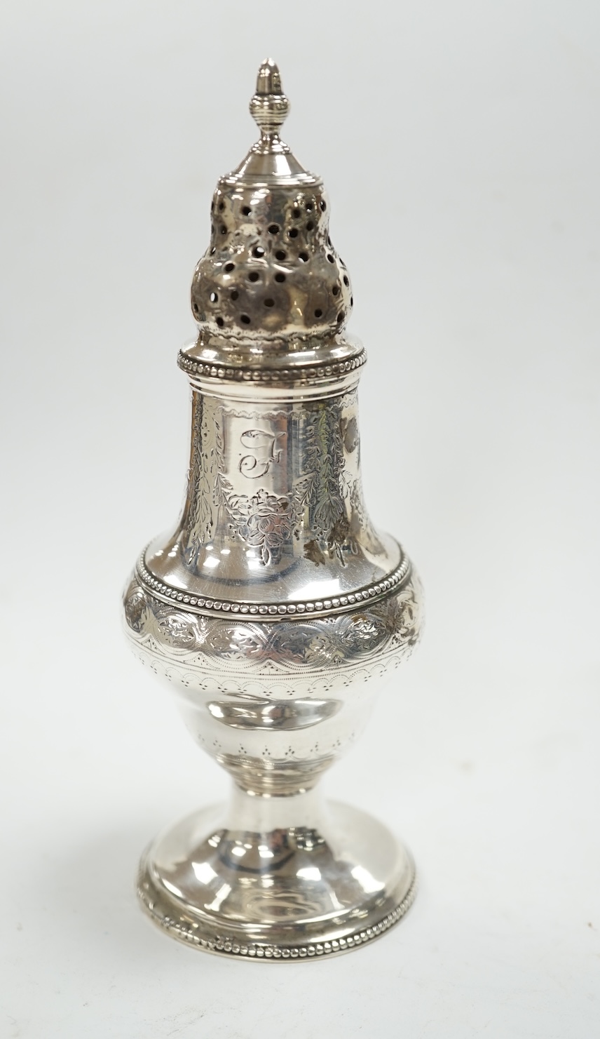 A George III silver baluster pepperette, Thomas Daniell, London, 1785, 14.6cm. Condition - poor